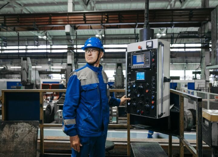 Factory maintenance worker doing a routine equipment check