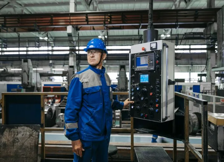 Factory maintenance worker doing a routine equipment check