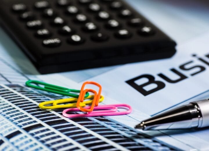 calculator, paperclip, ballpoint pen