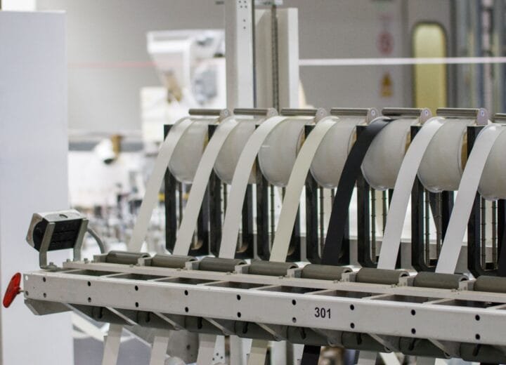 Modern industrial machine in operation in a manufacturing facility showcasing advanced technology.