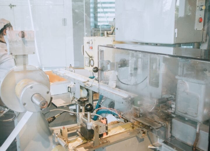 Close-up of advanced machinery in a modern laboratory setting, highlighting technology and industry.